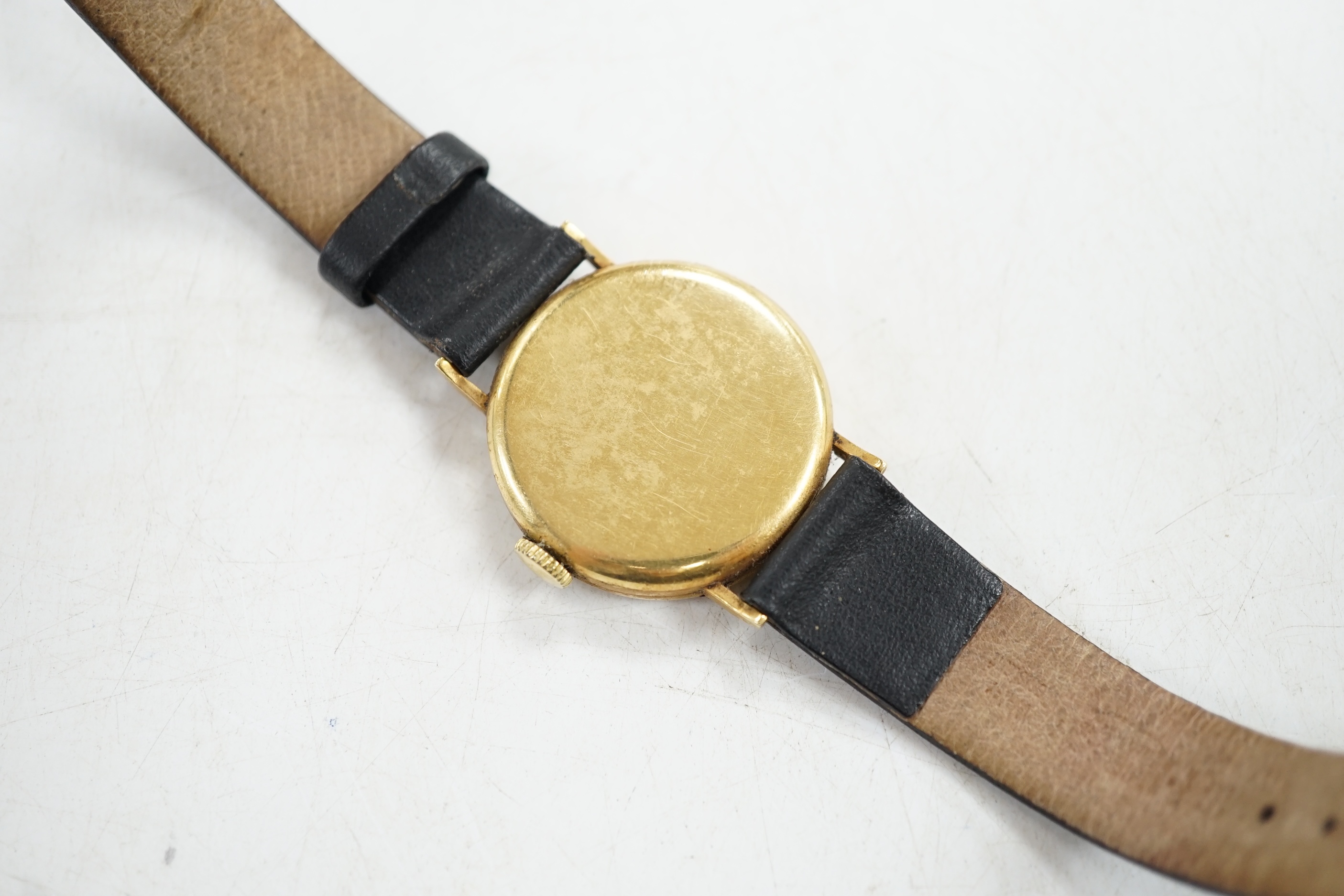 A Longines gentleman's 18ct gold wrist watch, with subsidiary seconds. Condition - appears to run, gauging to side, otherwise fair